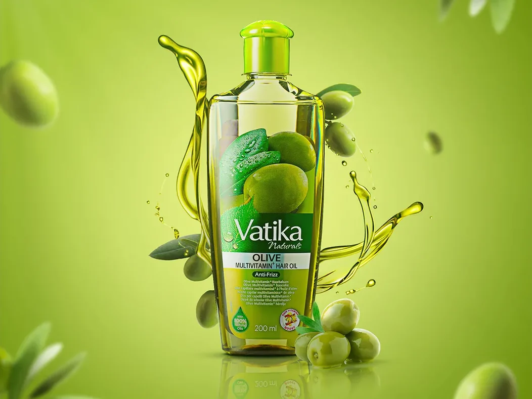 Vatika Olive Oil key visual: the bottle centred on an olive-green ground with a suspended oil pour, olives and leaves